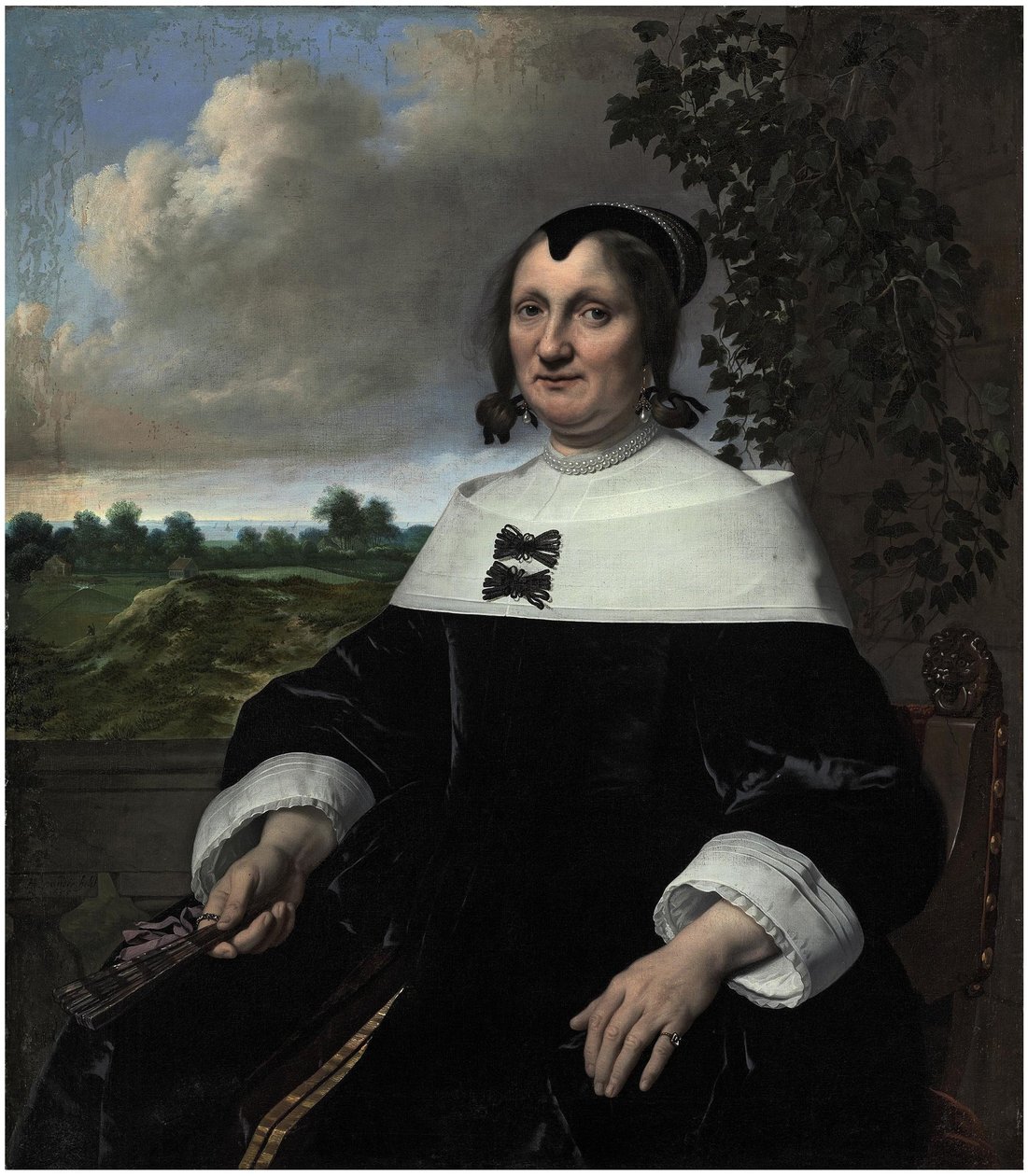 Porträt einer Dame, wahrscheinlich Hester du Pire, sitzend vor einer Balustrade, einen Fächer haltend, mit Blick auf das Meer im Hintergrund von Bartholomeus van der Helst