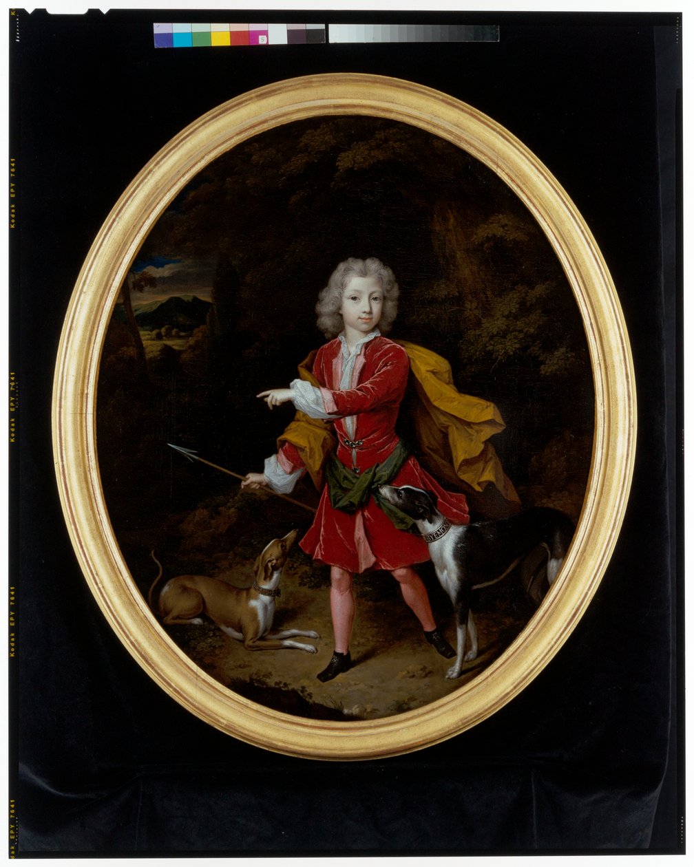Porträt eines jungen Mannes mit zwei Jagdhunden in einer Waldlandschaft von Constantin Netscher
