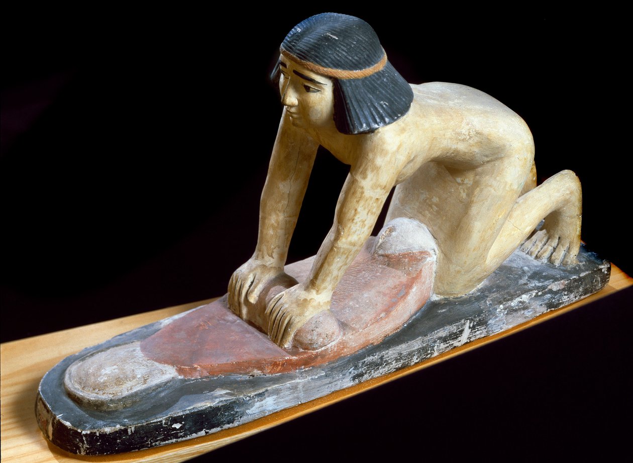 Ägyptische Antike: „Ägypter, der Getreide zerkleinert, um Brot zu machen“ Figur. 5. Dynastie. 2400 v. Chr. Florenz, Museo Archeologico von Egyptian 5th Dynasty
