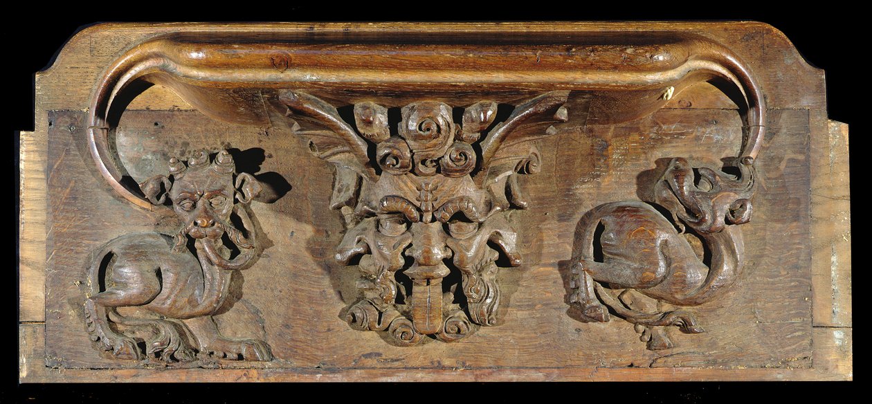 Eine Miserikordie, die drei menschliche Gesichter flankiert von Monstern darstellt, New College Chapel, Oxford, spätes 14. Jahrhundert von English School