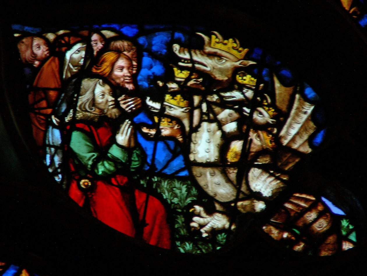 Das Westrosenfenster zeigt eine Szene aus dem Buch der Offenbarung: Anbetung des Drachen (13:4). von French School
