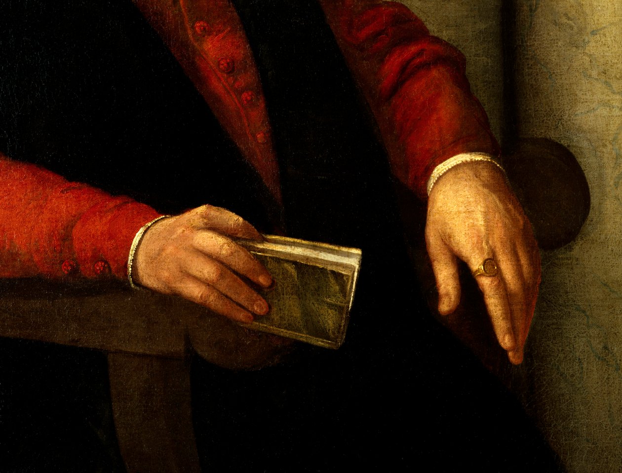 Vermutetes Porträt von Francois Rabelais (1494-1553), französischer Schriftsteller und Arzt. Detail des Buches, das er in der Hand hält, und des Ritters, den er am Finger trägt. Gemälde von Giovanni Battista Moroni (1525-1578) von Giovanni Battista Moroni