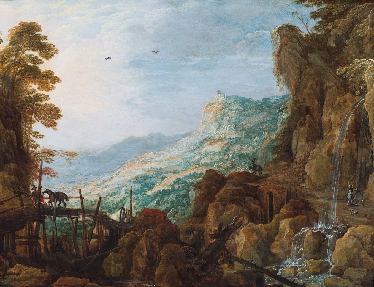 Eine felsige Berglandschaft mit einem Reiter auf einer Brücke und einem Wasserfall von Joos or Josse de The Younger Momper