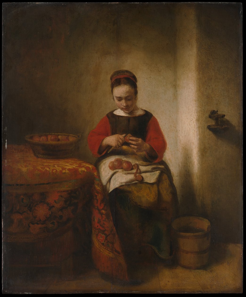 Junge Frau schält Äpfel von Nicolaes Maes