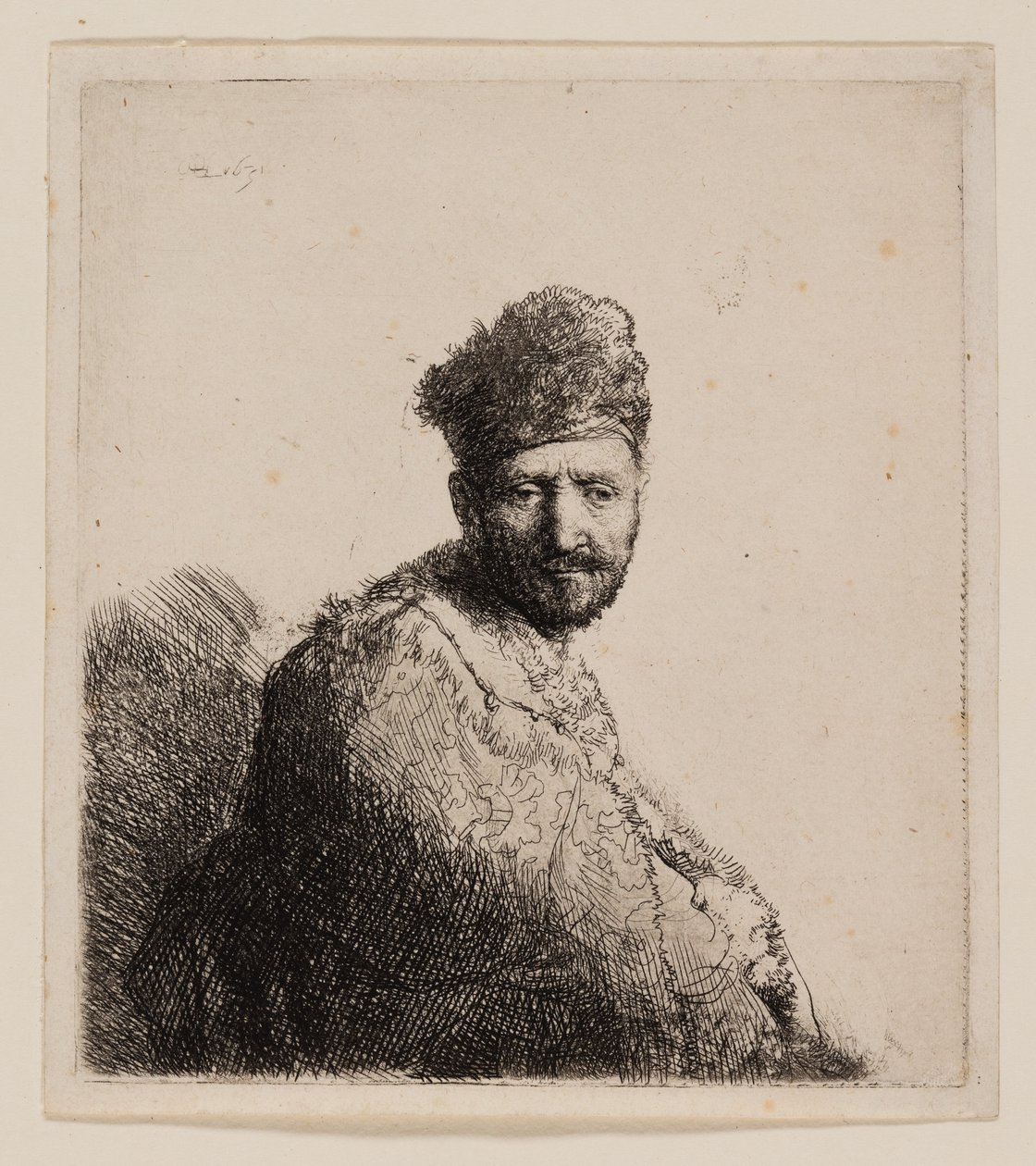 Bärtiger Mann in orientalischer Pelzmütze und Robe von Rembrandt van Rijn