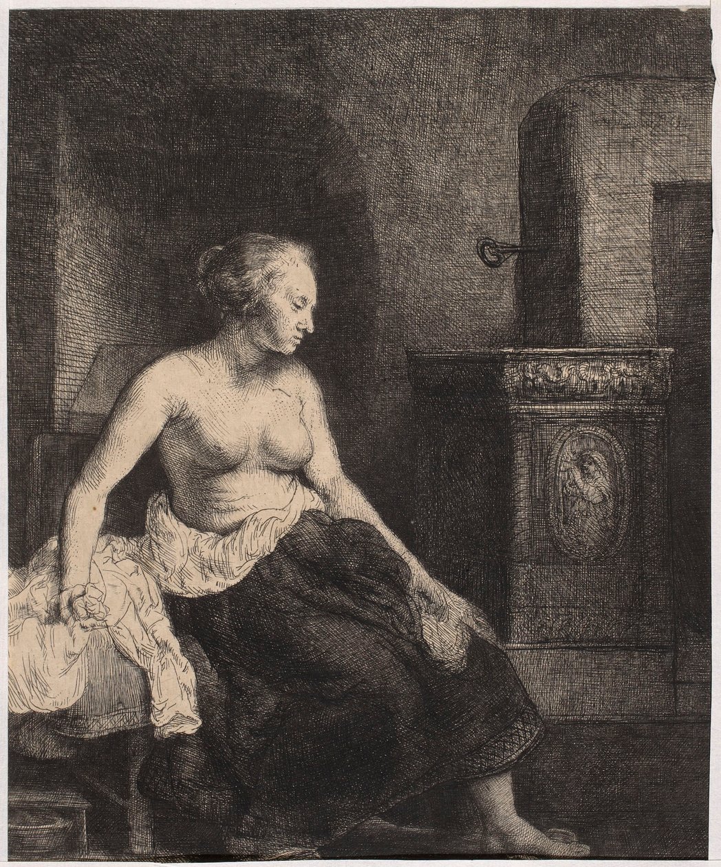 Halbnackte Frau, die am Ofen sitzt von Rembrandt van Rijn
