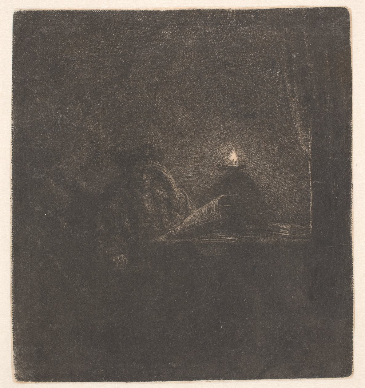 Student an einem Tisch bei Kerzenlicht von Rembrandt van Rijn