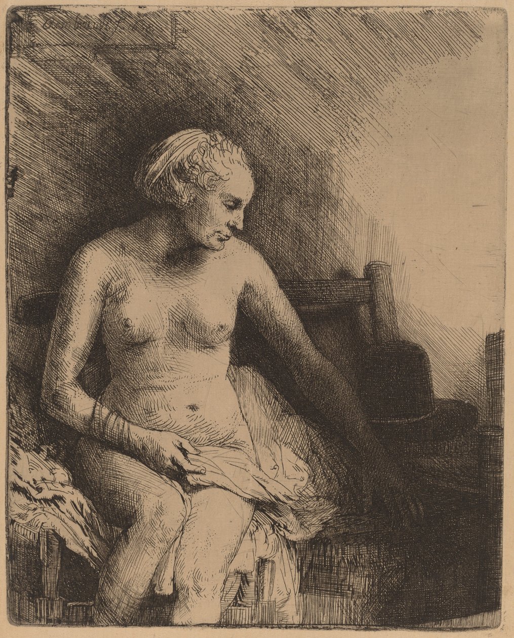 Frau beim Bad mit einem Hut neben ihr von Rembrandt van Rijn