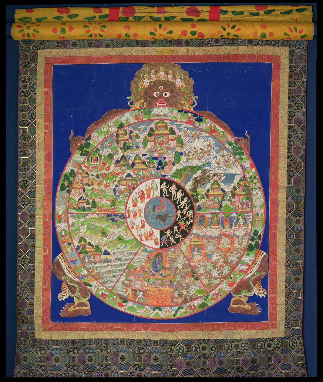 Dharmachakra-Rad des Lebens, gedreht von Yama, dem Herrn des Todes, mit Szenen, die die zwölf Verbindungen symbolisieren, die unkontrollierte Wiedergeburt verursachen, tibetisch, 1780-1850 von Tibetan School