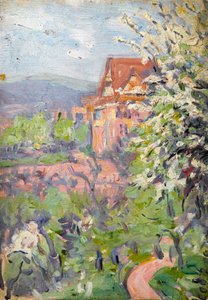 Haus mit Frühlingsblütenbaum im Vordergrund