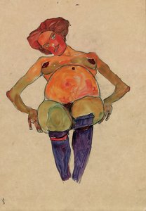 Sitzende schwangere Frau