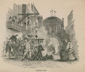 Eine Menschenmenge entzündet ein Lagerfeuer vor Temple Bar