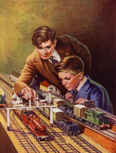 Jungen spielen mit einer Eisenbahn von English School