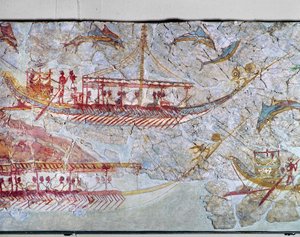 Schiffe umgeben von Delfinen