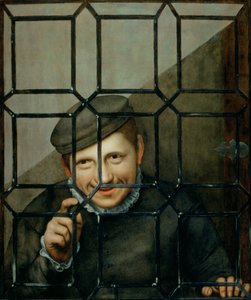 Ein Junge, der durch ein Fenster schaut