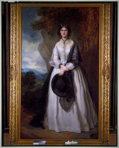 Porträt einer Dame in einem weißen Kleid, stehend in einer Landschaft von Francis Grant