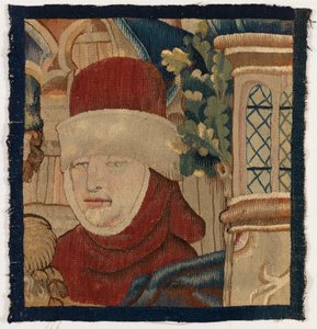Kleines Fragment eines Wandteppichs, das den Kopf eines Mannes darstellt, spätes 15. Jahrhundert