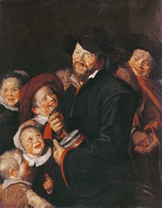 Mann, der Kinder mit einem Rummel unterhält