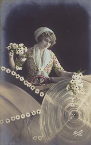 Eine junge Frau hält viele Blumen und arbeitet in einer Fabrik von French Photographer