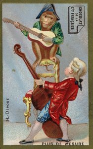Junge und Affe spielen zusammen Musikinstrumente
