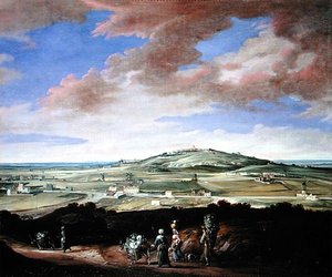 Landschaft mit einer Stadt auf einem Hügel