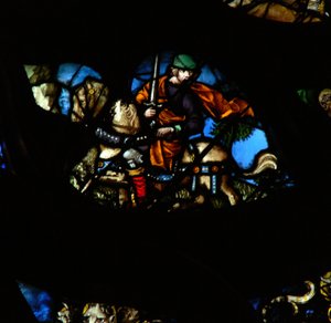 Das westliche Rosenfenster zeigt eine Szene aus dem Buch der Offenbarung: Ein Mann auf einem anderen Pferd (nicht rot, wie im Text) mit einem Schwert, um den Frieden von der Erde zu nehmen (6:4). von French School