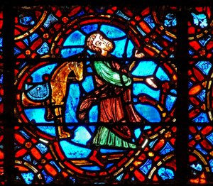 Fenster w12, Darstellung einer Szene im Fenster des barmherzigen Samariters: der Samariter steigt von seinem Pferd