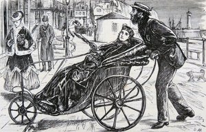 Patrick schiebt den Badestuhl der Dame