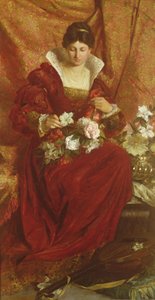 Eine Dame arrangiert Blumen