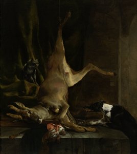 Ein Hund und eine Katze in der Nähe eines teilweise ausgeweideten Hirsches