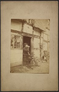 Sitzender Mann, der aus einem Krug im offenen Türrahmen trinkt von John Whistler