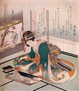 Eine Frau, die ein Miniaturmodell des Berges Fuji herstellt