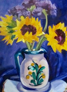 Sonnenblumen in blauer Kanne