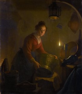 Frau in einer Küche bei Kerzenlicht von Michiel Versteegh