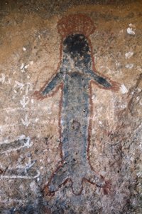 Aborigines-Felsmalerei, Figur einer Frau (Tiliqua?), in Uluru (oder Ayers Rock), im Northern Territory, in Zentral-Australien