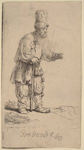 Ein Bauer mit hoher Mütze, stehend und auf einen Stock gelehnt von Rembrandt van Rijn