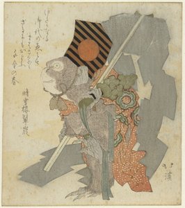 Dressierter Affe mit Glöckchen und Gohei