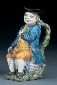 Toby-Krug mit blassem manganfarbenem Gesicht und Händen, hält einen leeren kugelförmigen bufffarbenen Krug in gewaschener blauer Jacke und Hose und grünem Wams, ca. 1800 von Unbekannt