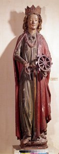 Darstellung der heiligen Katharina von Alexandria, die das Rad ihres Martyriums hält. Polychrome Holzstatue von Unknown artist
