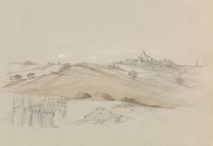 Ein Feld mit Haus in der Ferne