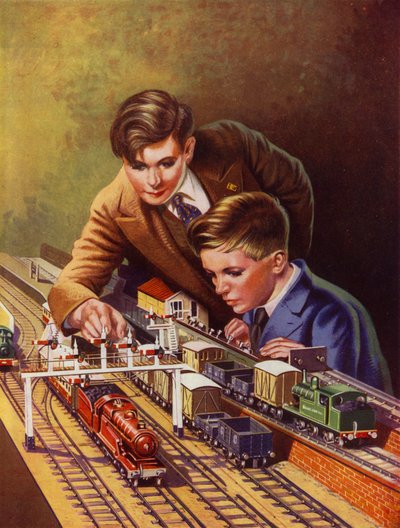 Jungen spielen mit einer Eisenbahn von English School