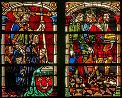 Fenster w232 zeigt eine Szene aus der Geschichte vom verlorenen Sohn: drei Figuren beim Fest der Rückkehr des verlorenen Sohnes; links der Stifter und St. Wilhelm von French School