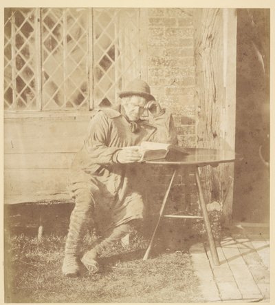 Mann liest ein Buch von John Whistler