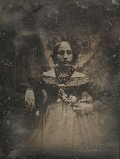 Junge Frau, die eine Blume hält von Joseph Philibert Girault De Prangey