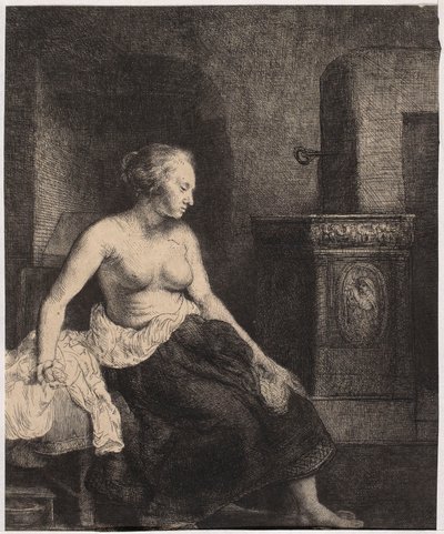 Halbnackte Frau, die am Ofen sitzt von Rembrandt van Rijn