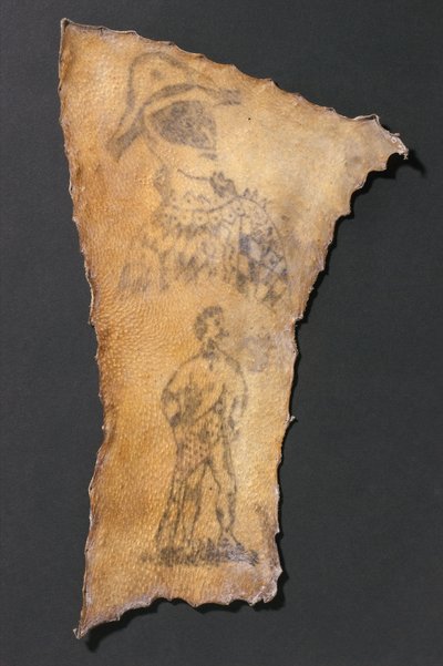 Menschliche Haut, tätowiert mit Harlekin und Figur von Samson, Französisch von John Pardon