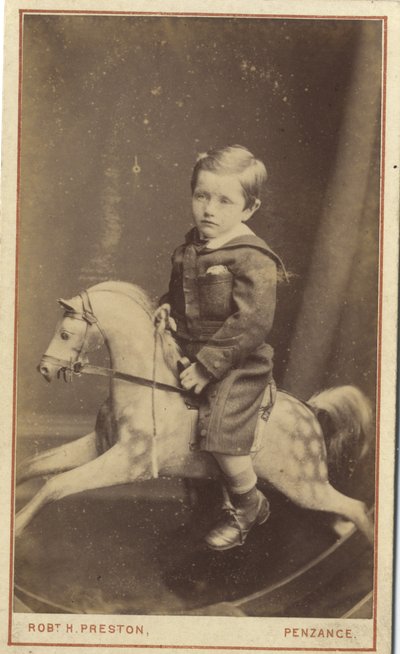Junge auf einem Schaukelpferd von Robert H. Preston