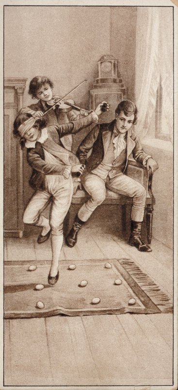 Junge spielt ein Spiel, bei dem er versucht, blindlings nicht auf Eier zu treten von English School