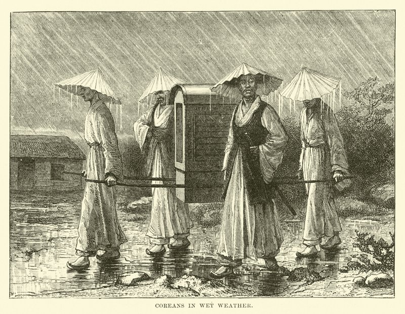 Koreaner bei nassem Wetter von English School