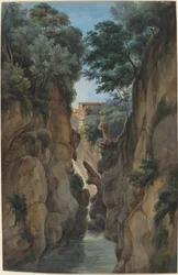 Blick auf einen Wasserfall durch eine Schlucht